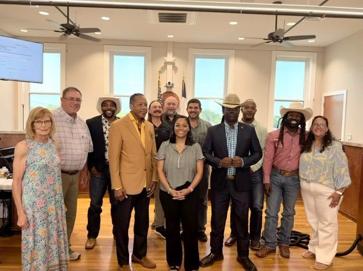 LCS board members and Lampasas city officials standing together in the council chamber, June 2026